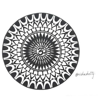 Hand-drawn black and white OM-Mandala art by Nisha Shetty at ArtyliciouzOfficial, featuring intricate patterns and designs. The artwork showcases a circular design with symmetrical patterns radiating from the center, creating an effect similar to a blooming flower.