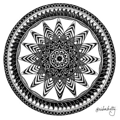 Hand-drawn black and white Sharpie mandala art by Nisha Shetty at ArtyliciouzOfficial, showcasing intricate geometric patterns. The artwork features multiple layers of circles filled with different patterns including zigzags, dots, lines, and floral shapes, radiating from a central star-like pattern mandala.