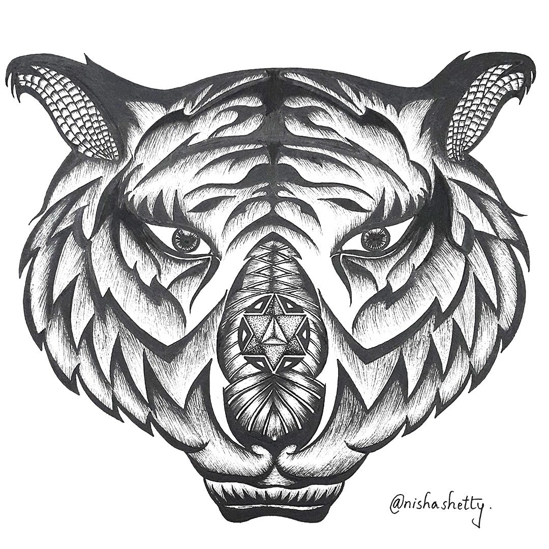 Hand-drawn Sharpie art of a detailed and symmetrical tiger’s face, created by artist Nisha Shetty, featured on Artyliciouz Official.